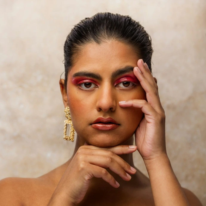 woman with gold ring on her left hand